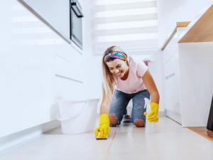 woman cleaning tile floor