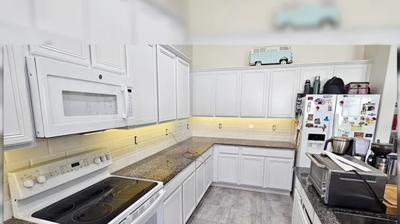 New Tile Installation Replaces Outdated Backsplash & Carpeting