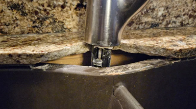 This BEFORE image shows the granite countertop damage. Photo