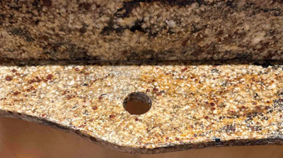 This AFTER image shows the repaired granite countertop. Photo