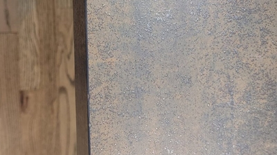 This AFTER image shows the repaired countertop. Photo