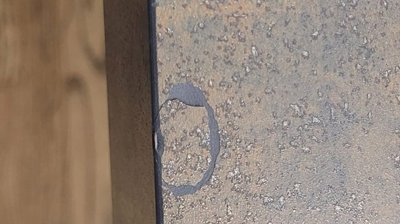 This image, taken part way through the repair process, shows the countertop chip reattached to the countertop. Photo