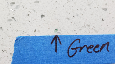 This BEFORE image shows one of many green flecks we removed. Photo