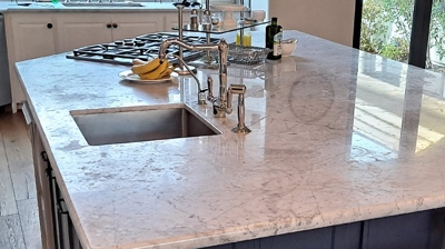 This BEFORE image shows dullness and etch damage on the island top. Photo