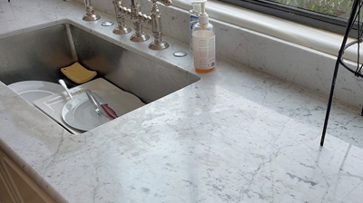 Notice the etch damage near the sink in this BEFORE image. Photo