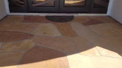 Notice how warm and welcoming this entrance is AFTER our flagstone services. Photo