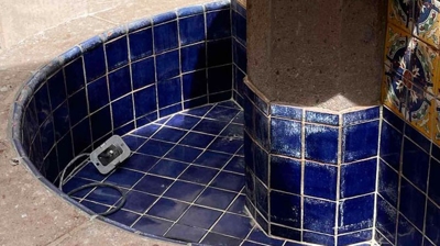 The blue tiles were revealed after the yellow scale was removed. Photo