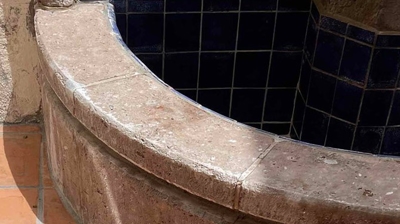 Notice the mineral deposits from water overspray along the fountain ledge. Photo