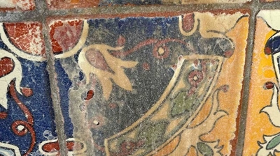 Here is a closeup of one of the decorative tiles BEFORE media blasting. Photo