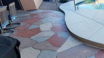 Notice the flat, fake appearance of the flagstone next to the pool in this BEFORE image. Photo