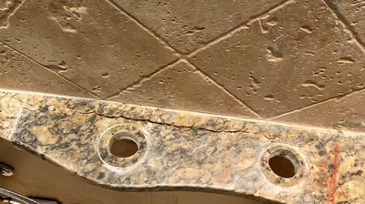 This BEFORE image shows the cracked granite. Photo