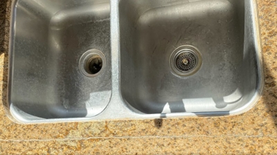 This BEFORE image shows the crack in the granite in front of the sink. Photo