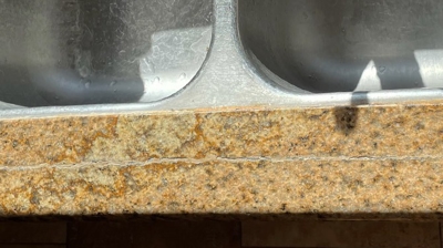 Here's a closer look at the crack in the granite in front of the sink. Photo