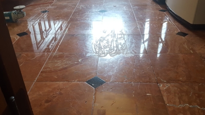 At this angle, with the light from the window reflecting on the finish, you can see the evidence of the futile attempts. Photo