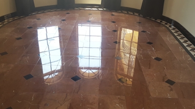 We removed the etching and refinished the floor. As you can see, there is no more etch damage. Photo