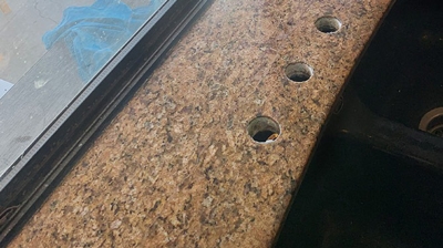 This AFTER image shows the repaired and refinished granite. Photo