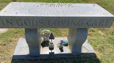 The engravings are obscured by calcium deposits. Photo