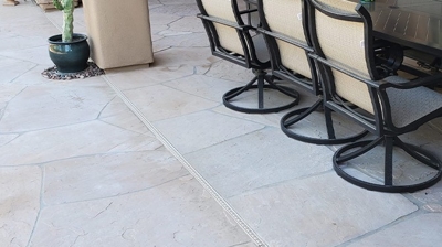 Notice the colorless appearance of the flagstone in this BEFORE image. Photo