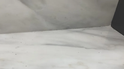 We carefully scraped a bit of paint from the countertop. Photo