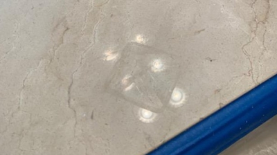 Here is a deep etch mark in the marble, BEFORE we did any restoration work. Photo