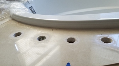 The tub surround needed some professional attention, too, as you can see in this BEFORE image. Photo