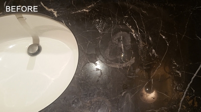 The etching and damage to the finish was especially severe around the sink. Photo