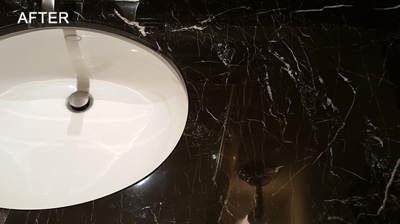 We honed, polished, and sealed this marble. What a difference! Photo