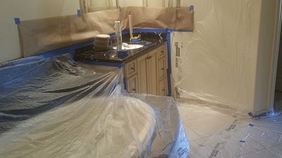 We always use brown paper, sheets of plastic, masking tape, and other protective measures to ensure surfaces are protected. Photo