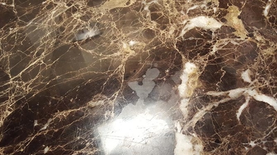 Here is another BEFORE image, showing etch damage on the marble finish. Photo