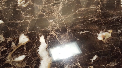 Here is the same section of marble as the previous image, AFTER honing and polishing. Photo