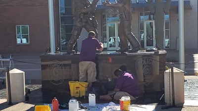 This image shows our skilled technicians, hard at work restoring the granite. Photo