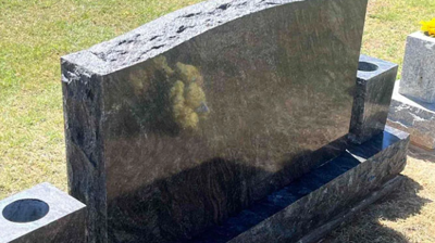 This AFTER image shows the back side of the restored headstone. Photo