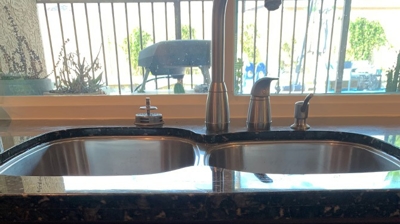 This AFTER image shows the repaired and refinished granite countertop. Photo