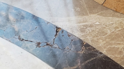 Notice the cracks in the stone on this decorative inlay. Photo