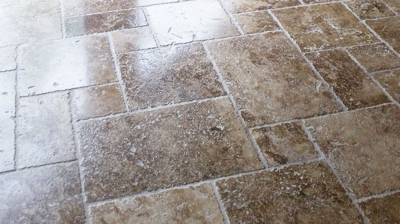 This travertine looked so much better with the old sealer removed and the appropriate sealer applied. Photo