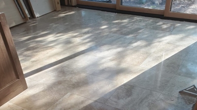 Here is the bedroom floor BEFORE. Notice the honed/matte finish. Photo