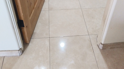 This AFTER image demonstrates the dramatic improvement in the appearance of the travertine finish. Photo