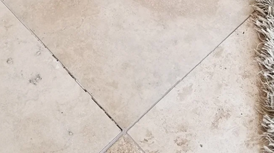 Some of the grout lines needed professional attention, as you can see in this BEFORE image. Photo