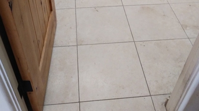 This BEFORE image shows how dull the travertine finish was before our restoration work. Photo