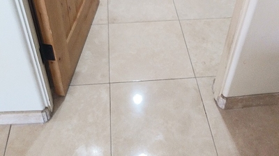 This AFTER image demonstrates the dramatic improvement in the appearance of the travertine finish. Photo