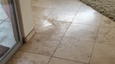 In this BEFORE image you can see that in some areas the travertine finish was badly damaged. Photo