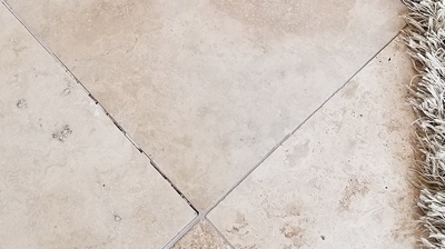 Some of the grout lines needed professional attention, as you can see in this BEFORE image. Photo