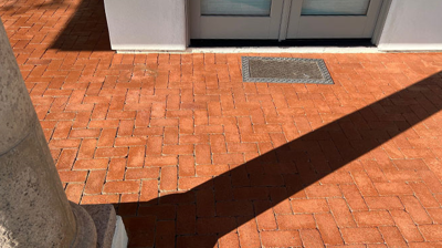 We reset and leveled the brick pavers, as you can see in this AFTER image. Photo