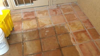 This image was taken during the Saltillo cleaning process to show the dramatic difference. Photo