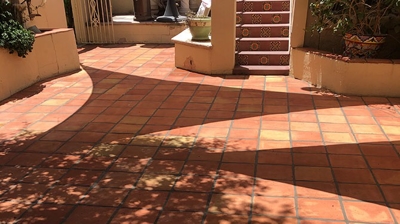 Here is the same area, AFTER restoration. Now the patio is entertainment ready and gorgeous! Photo