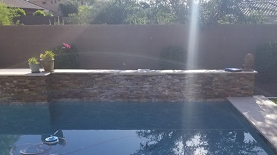 This BEFORE image shows the calcium buildup from the water features. Photo