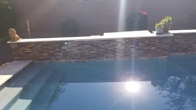 Here is another BEFORE image showing the calcium buildup from the water features. Photo