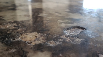 This BEFORE image shows some granite countertop chips. Photo