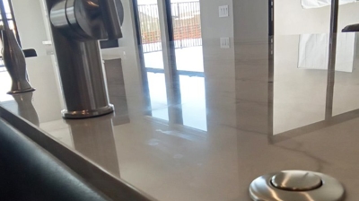 Here is a close-up image of the dull spots near the plumbing fixtures, taken BEFORE we began our work. Photo