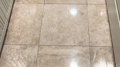 Notice the weird textured appearance of the travertine finish in this BEFORE image. Photo